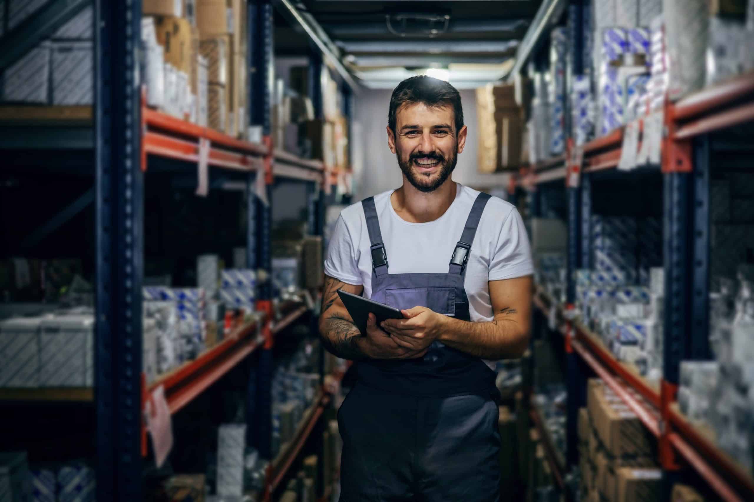 Man standing in warehouse aisle